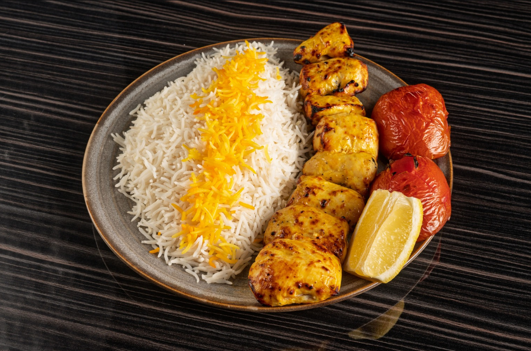 Saffron Chicken Joojeh Kabab with lemon and basmati rice at Aban Restaurant